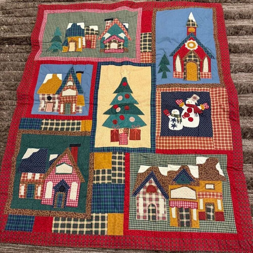 Beautiful handmade quilt with cute houses and trees